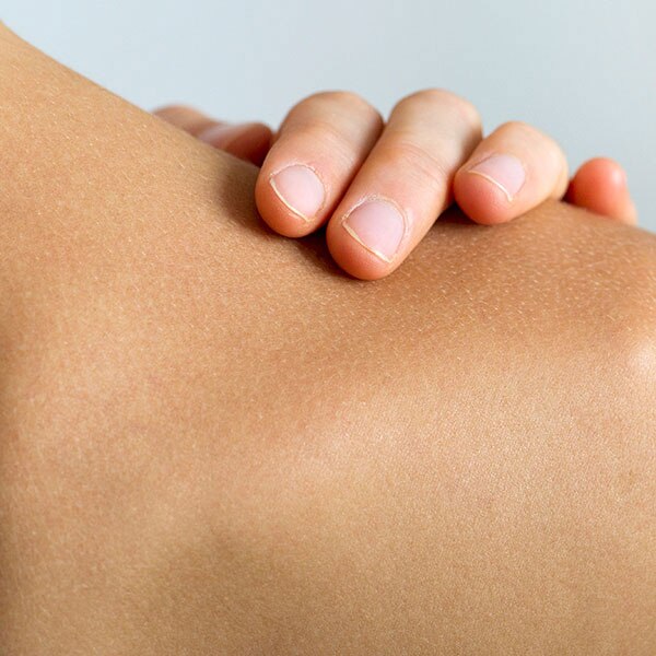 Hand touching the shoulder	